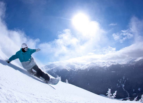 Snowboarder on a ski piste in Whistler